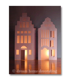 two handmade white paper houses