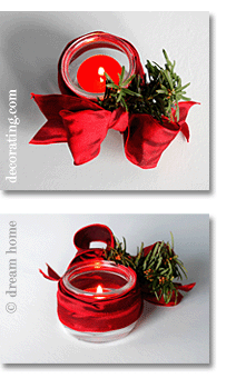 christmas light made of dessert glass with red bow, evergreen twig and tealight