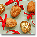 Christmas tree decorating with gilded walnuts