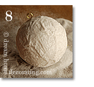 Covering a white styrofoam Christmas ornament ball in snow glitter