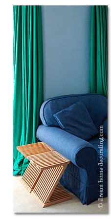 blue sofa with beech side tables and turquoise curtains