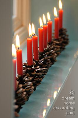 Windowsill decoration with pine cone candle holders