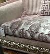 Silver-framed sofa with light greyish purple upholstery fabric