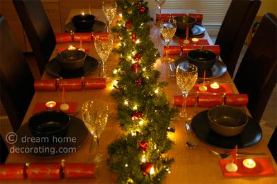 Our Christmas table with the garland and Christmas crackers