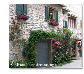 red flowers on a Tuscan house