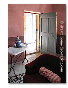 rustic French living room in blue, red & grey