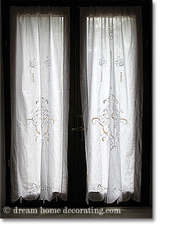 white renaissance cutwork panels in a Tuscan bedroom window
